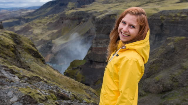 Tourist exploring Iceland, admiring its canyons