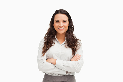 Portrait of an businesswoman with folded arms against a white background