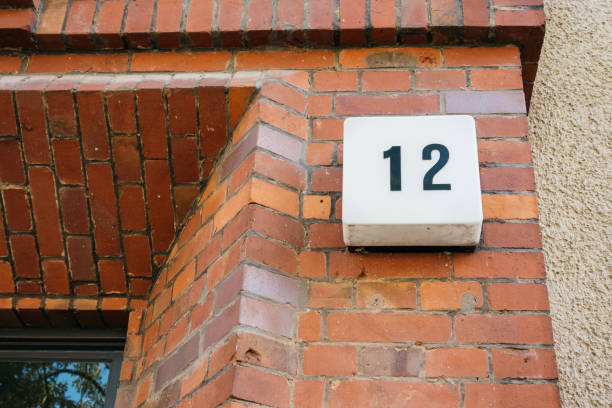 istock number twelve sign on a brick wall 842253994