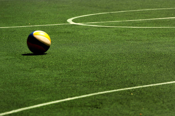 Volleyball ball on green field