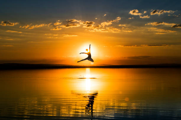 istock young ballet dancing on the lake in the evening 842254620