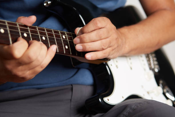 istock Close up of a lefty electric guitar being played 842263298