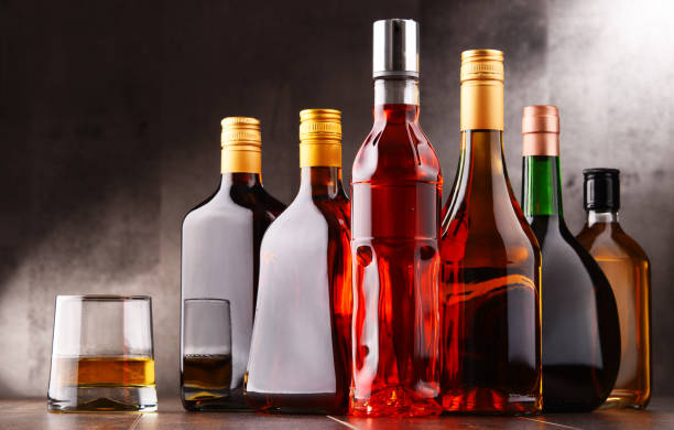 istock Glass and bottles of assorted alcoholic beverages. 842263492