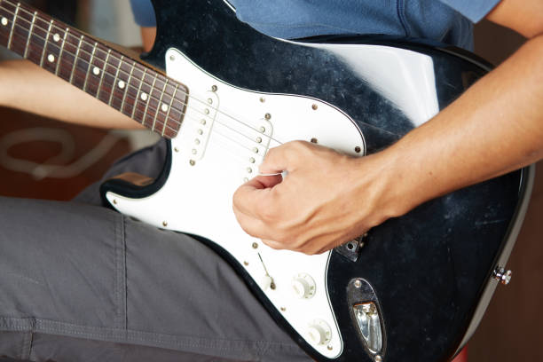istock Close up of a lefty electric guitar being played 842265912