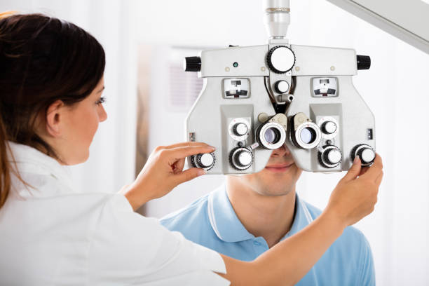 istock Female Optometrist Adjusting Phoropter For Patient 842265930