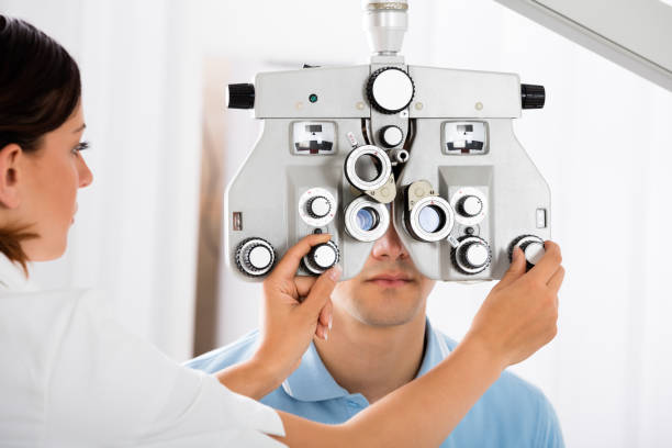 istock Female Optometrist Adjusting Phoropter For Patient 842266024