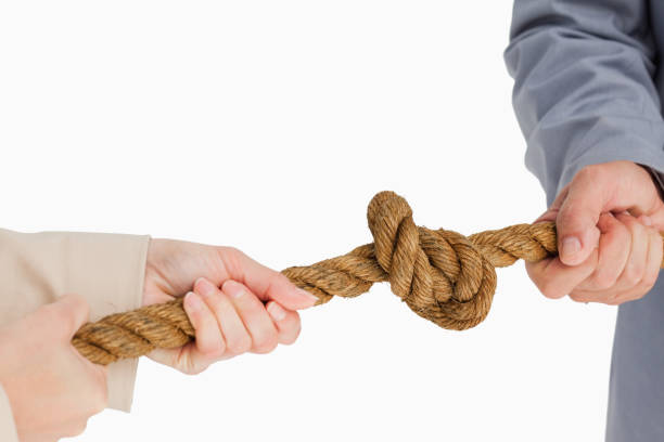 istock Business people tightening a knot 842266530