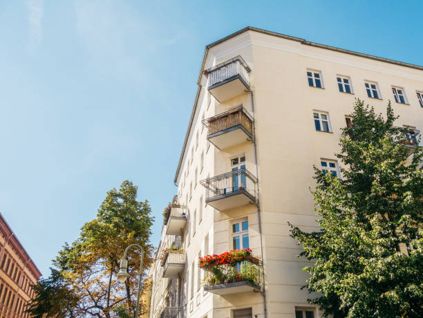 istock white corner house in a street next to an brick building 842266724