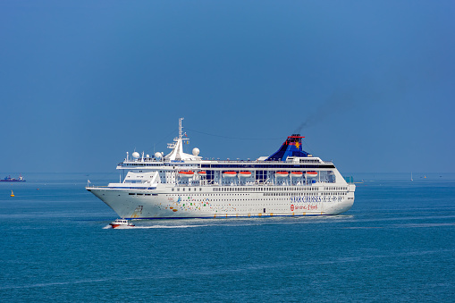 MSC Poesia cruise ship in the port of Gdynia, Poland. Entering the port and mooring at the French Quay.