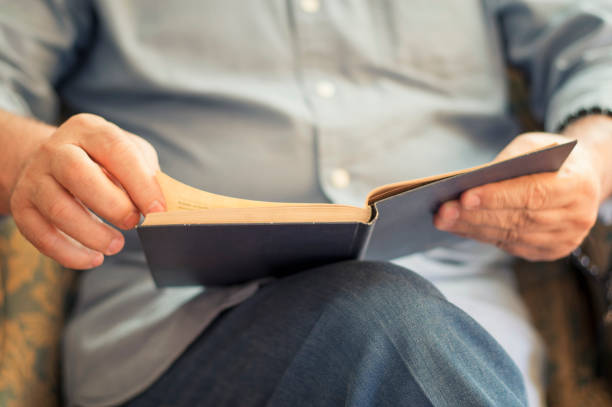 istock Senior Man Reading A Book At Home 842272116