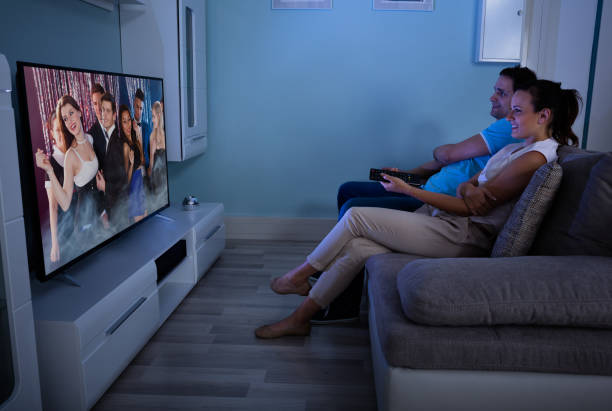 istock Happy Couple Watching Film Together 842272512