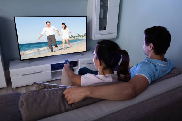 istock Couple Watching Movie Together 842272562