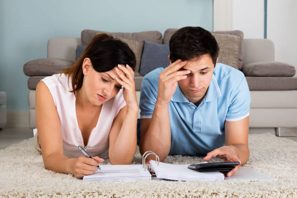 istock Unhappy Couple Calculating Bills 842273670