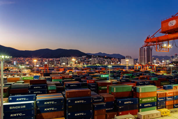 Night panorama of Busan port Busan: Night wide angle panorama of cargo vessel in the port of Busan, South Korea, the fifth largest container terminal harbor in the world. busan port stock pictures, royalty-free photos & images