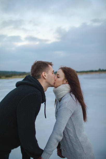istock Couple kissing outdoors in winter 842289400