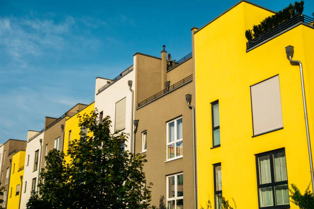 istock yellow, grey and white row houses in berlin 842292998