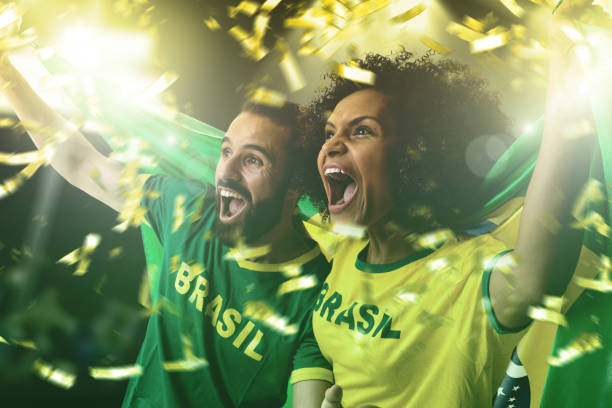 Brazilian couple fans celebrating on white background People Collection brazilian culture stock pictures, royalty-free photos & images