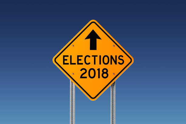 istock Yellow 2018 Elections Ahead Traffic Sign on Blue Sky 842295848