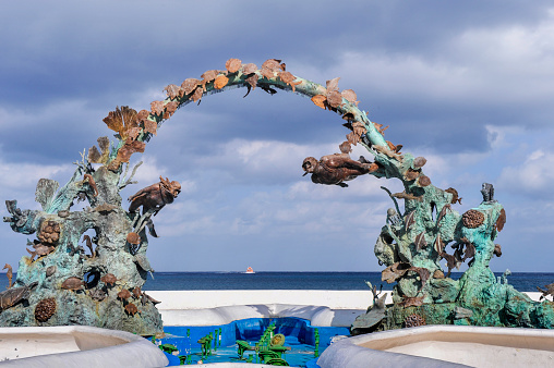 Cozumel, Mexico - October 12, 2012: There is a sculpture sitting at side of Av.Rafael E.Melgar.\n