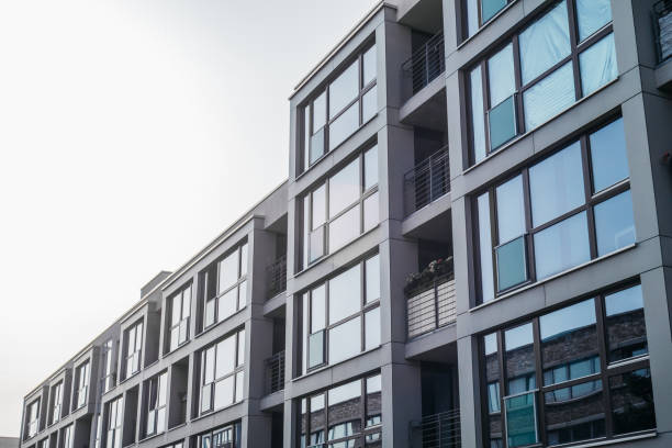 istock grey facaded office house with big windows 842298864