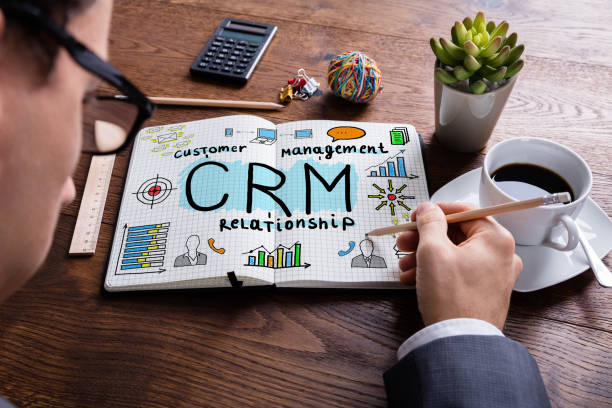 istock Businessperson Drawing Customer Relationship Concept On Notebook 842299886