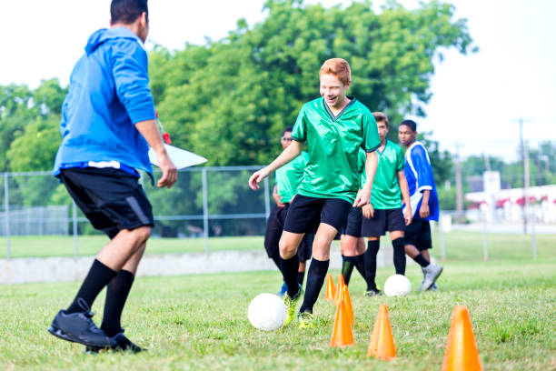 istock Soccer coach works with team before game 842300016