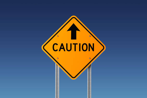 istock Yellow Caution Traffic Sign on Blue Sky 842300028