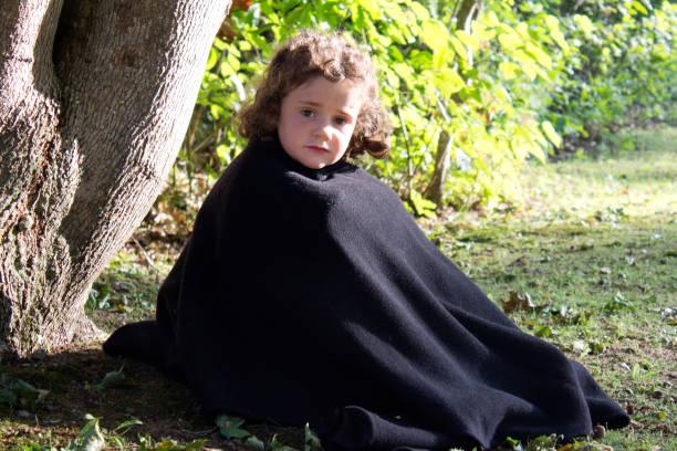 istock girl in blanket in sun 842302540