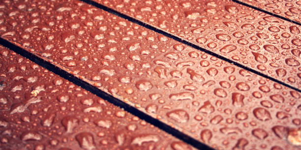 istock Wooden surface. Water drops on wood. Copy space. 842305558