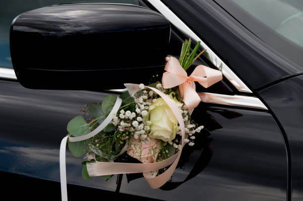 istock romantic flowers hanging on mirror of a car 842311118
