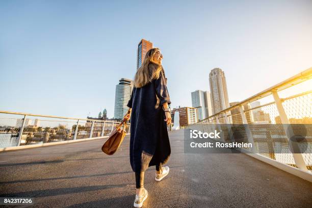 Woman Walking In Rotterdam City Stock Photo - Download Image Now - City, Walking, People