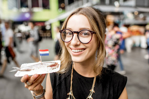 istock Woman with dutch herring 842318660