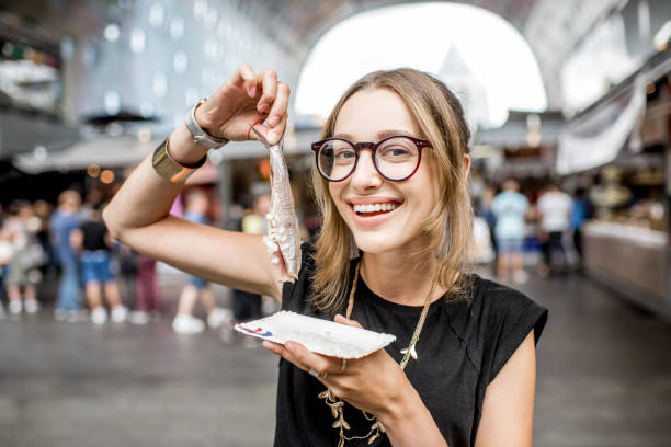 istock Woman with dutch herring 842318706