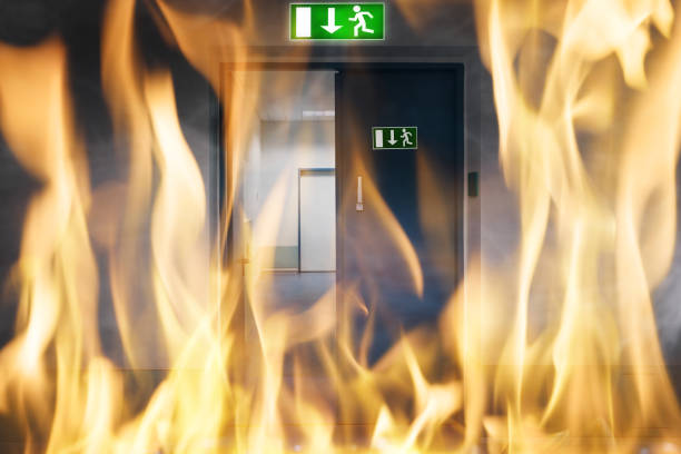 Green Emergency Evacuation Sign On Metal Door