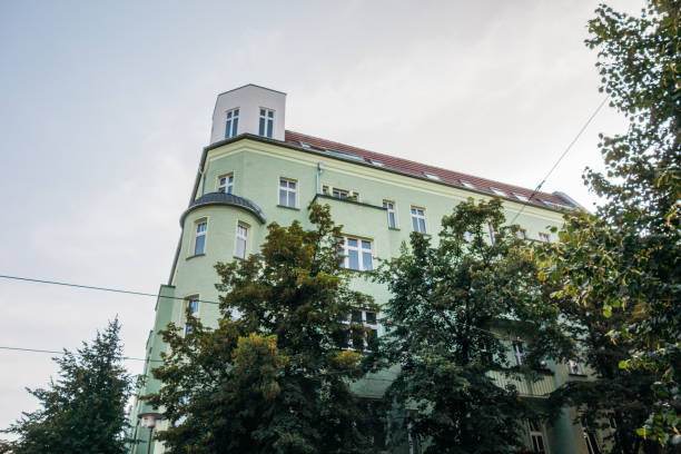 istock green corner building inbetween of big trees 842324144
