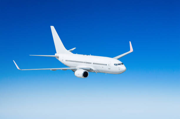 istock Airplane in the sky above the clouds flight journey sun height 842330398
