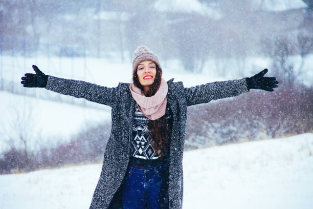 istock woman raising hand on the snow 842336656