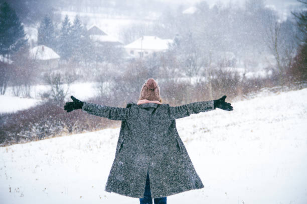 istock woman raising hand on the snow 842336772