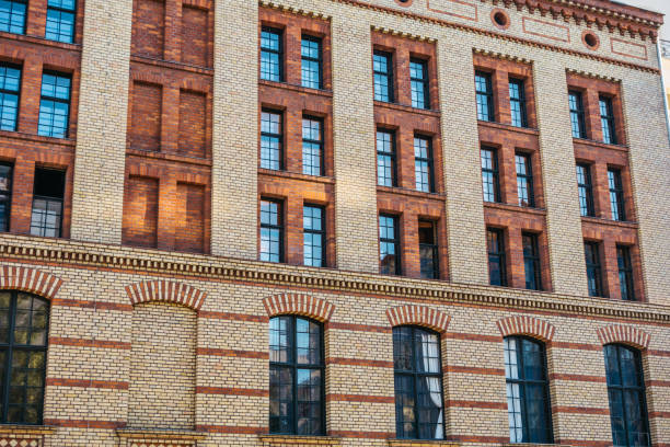 istock brick industrial building with big windows 842337780