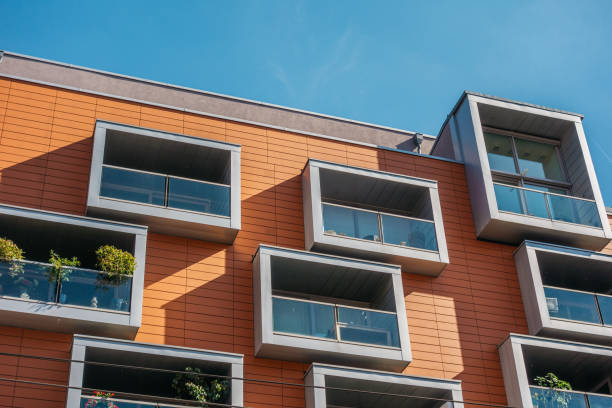 istock detailed view of modern balcony on orange facaded building 842340048