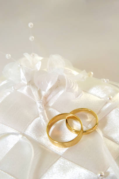 istock Gold Wedding Rings on Cushion 842340506