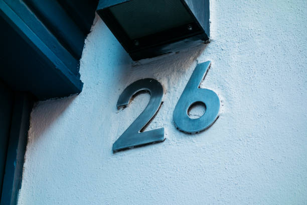 istock number 26 in steel letters on white wall 842340566