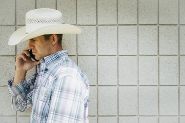 istock Cowboy on the Phone Rodeo Portraits 842343644