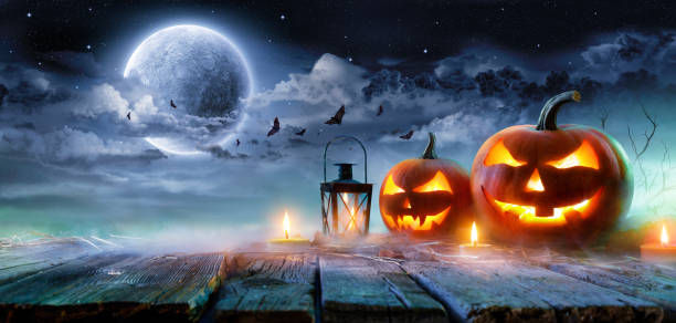 istock Jack O’ Lanterns Glowing At Moonlight In The Spooky Night - Halloween Scene 842347198