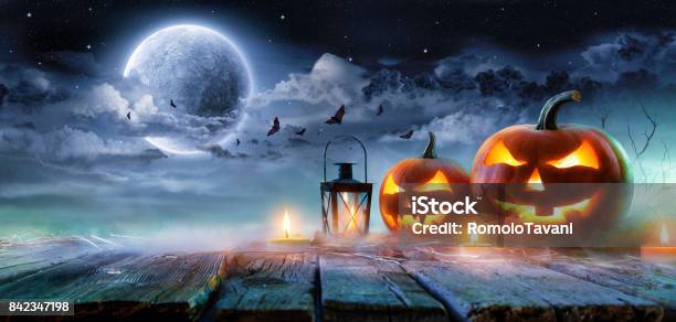 Jack O Lanterns Glowing At Moonlight In The Spooky Night Halloween Scene Stock Photo - Download Image Now