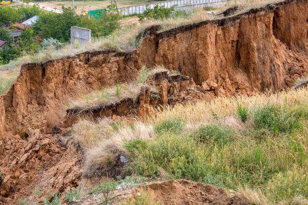 istock Soil landslide on slopes after earthquake. 842350330