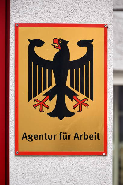 german shield for job agency - arbeitsamt imagens e fotografias de stock