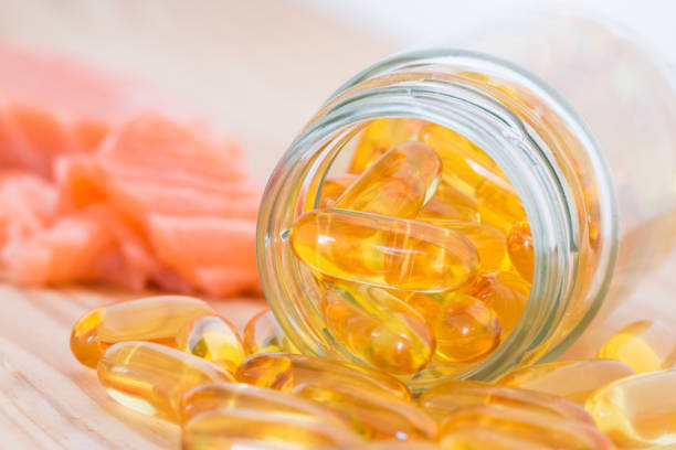 istock Pure omega salmon oil capsul and salmon. 842362682