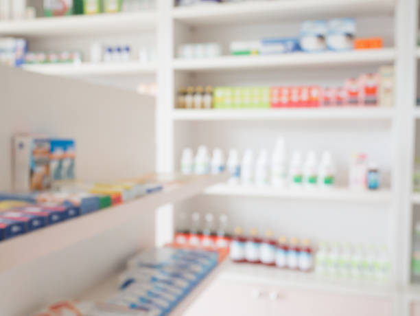 istock Pharmacy store shelves interior with blurred background 842362924