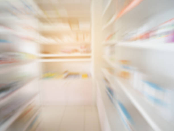 istock Pharmacy store shelves interior with blurred background 842362934